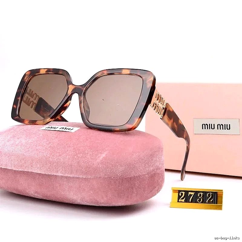 Miu Miu Patterned Oversized sunglasses Black Oval Sunglasses with Polished Detail